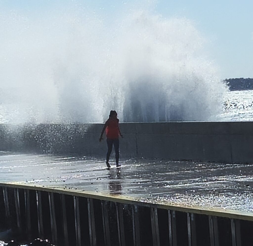 Young person on the pier in Port Elgin Ontario