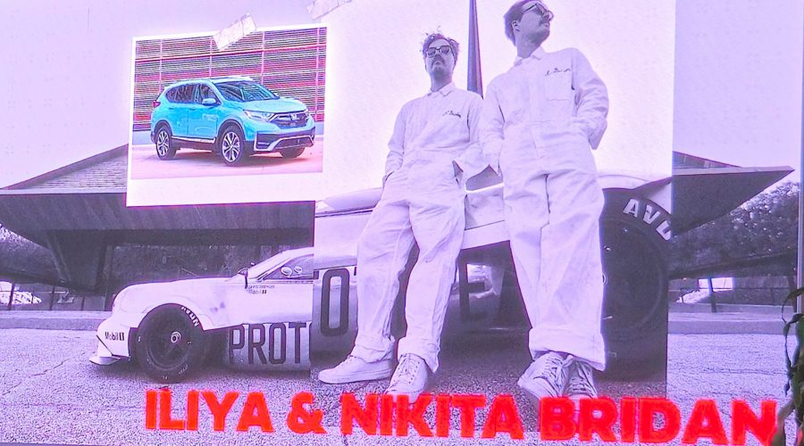 Iliya And Nikita Brydan Standing In Front Of The Half 11
